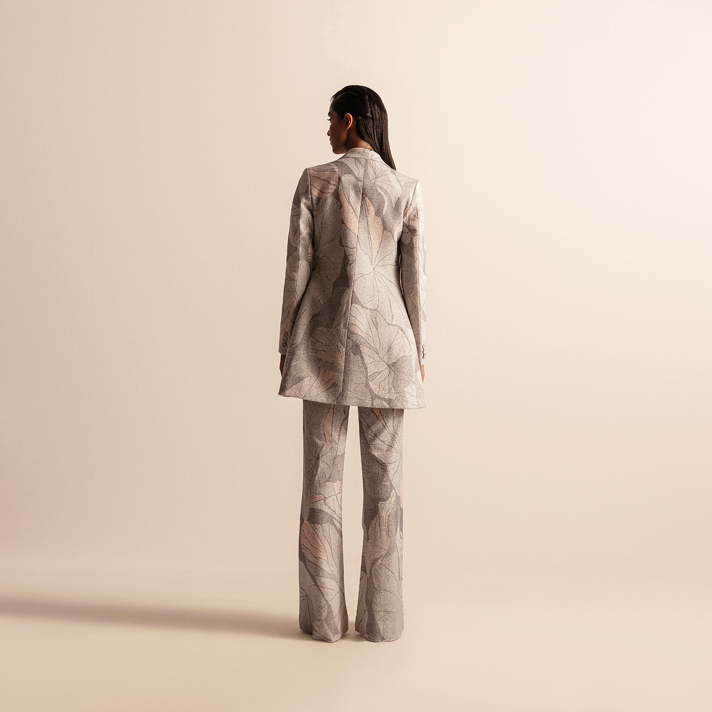 Back view of Nadru printed pant suit with jacket and pants –  printed jacket back, printed pants, designer womenswear, bold fashion, statement suit back, ethnic print suit