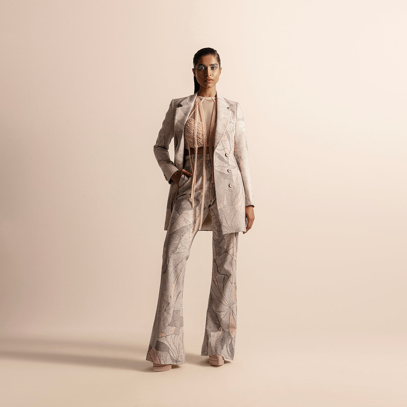 Full view of Nadru printed pant suit with jacket and flared pants –  printed jacket, printed pants, designer womenswear, bold fashion, statement pant suit