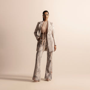 Full view of Nadru printed pant suit with jacket and flared pants –  printed jacket, printed pants, designer womenswear, bold fashion, statement pant suit