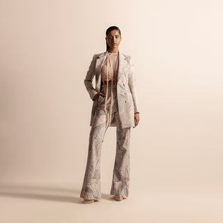 Full view of Nadru printed pant suit with jacket and flared pants –  printed jacket, printed pants, designer womenswear, bold fashion, statement pant suit