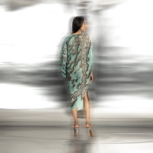 back view of Women's reef printed overlap dress with back drape and asymmetrical hem – artistic statement silhouette for contemporary fashionwear