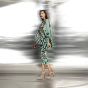 side view of Women's reef printed overlap shoulder dress with sculpted drape and asymmetrical hem – artistic statement wear, asymmetrical drape