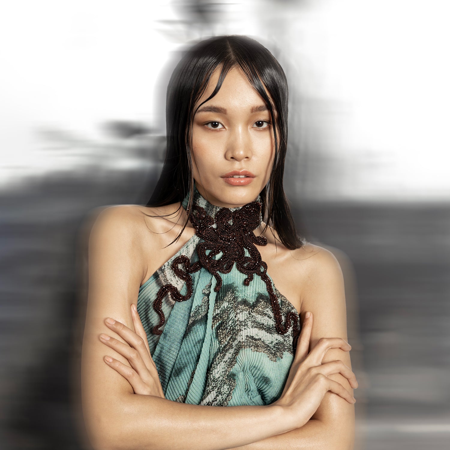 close-up of Women's halter neck draped gown with reef print and intricately embellished 3D collar – 3D embellished collar, reef print dress