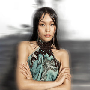 close-up of Women's halter neck draped gown with reef print and intricately embellished 3D collar – 3D embellished collar, reef print dress