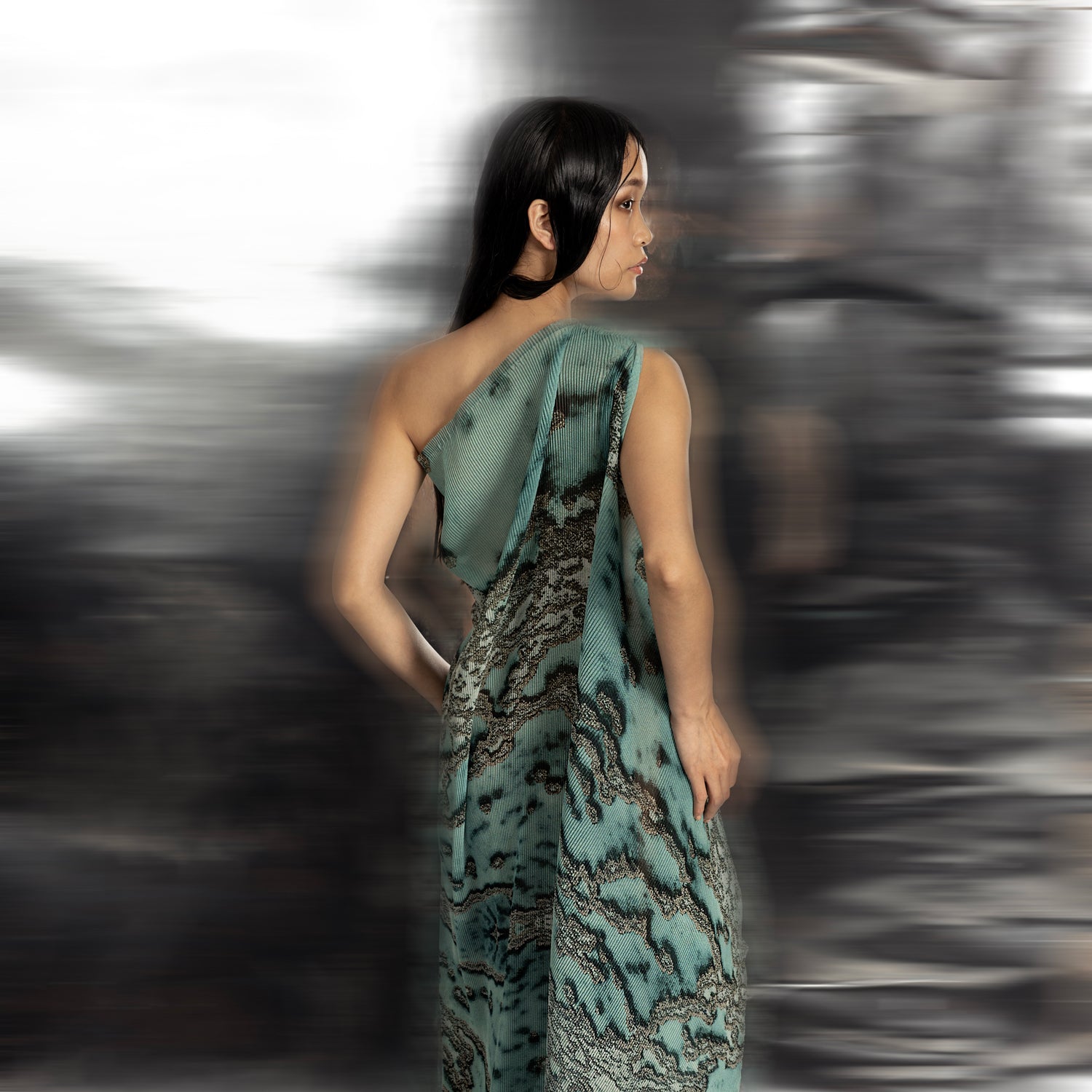 back view of Women's asymmetrical reef gown back view with flowing coral-textured drape – luxury one-shoulder silhouette with sculpted elegance
