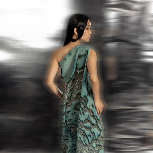 back view of Women's asymmetrical reef gown back view with flowing coral-textured drape – luxury one-shoulder silhouette with sculpted elegance
