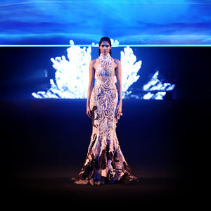 Front view of reef-embroidered fishtail gown on runway with sheer texture and marine motifs – couture evening fashion 