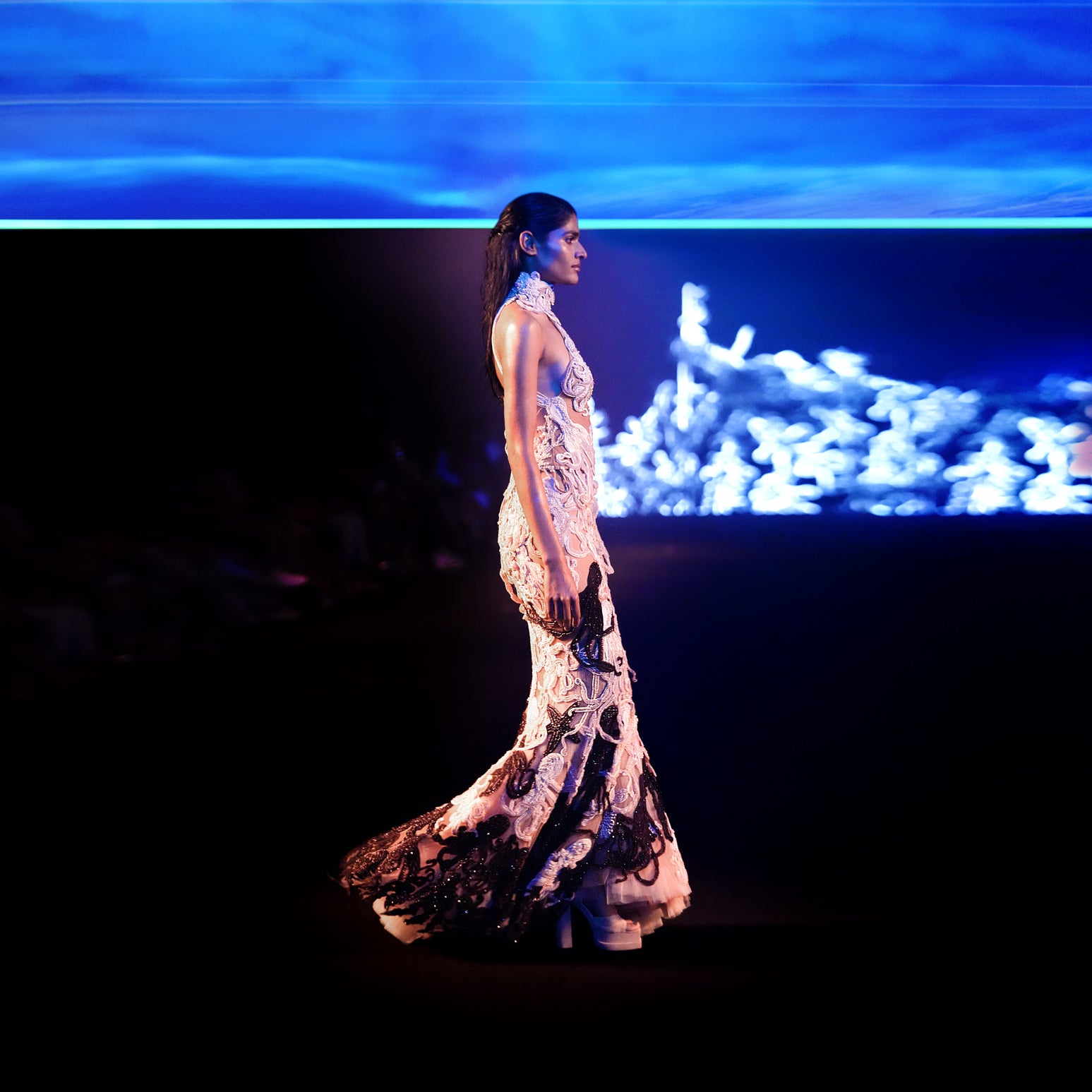 Model on runway in reef-inspired fishtail gown with sheer panels and marine embroidery – reef fishtail dress