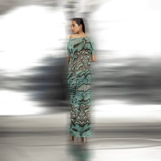back view of Women's ocean reef print pleated gown with keyhole back and soft drop shoulder – fluid asymmetrical evening dress