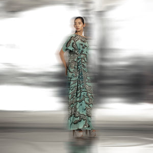 full body view of Women's reef printed drop-shoulder gown with pleated gathering and side slit – contemporary ocean-inspired couture