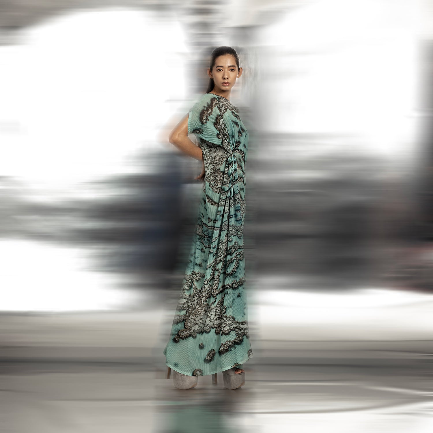 side view of Women's reef print gathered drape gown with drop-shoulder sleeves and side pleats – fluid contemporary couture, reef print gown