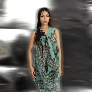 upperbody view of Women's reef printed draped V-neck dress with textured coral applique – fluid artisanal couture piece