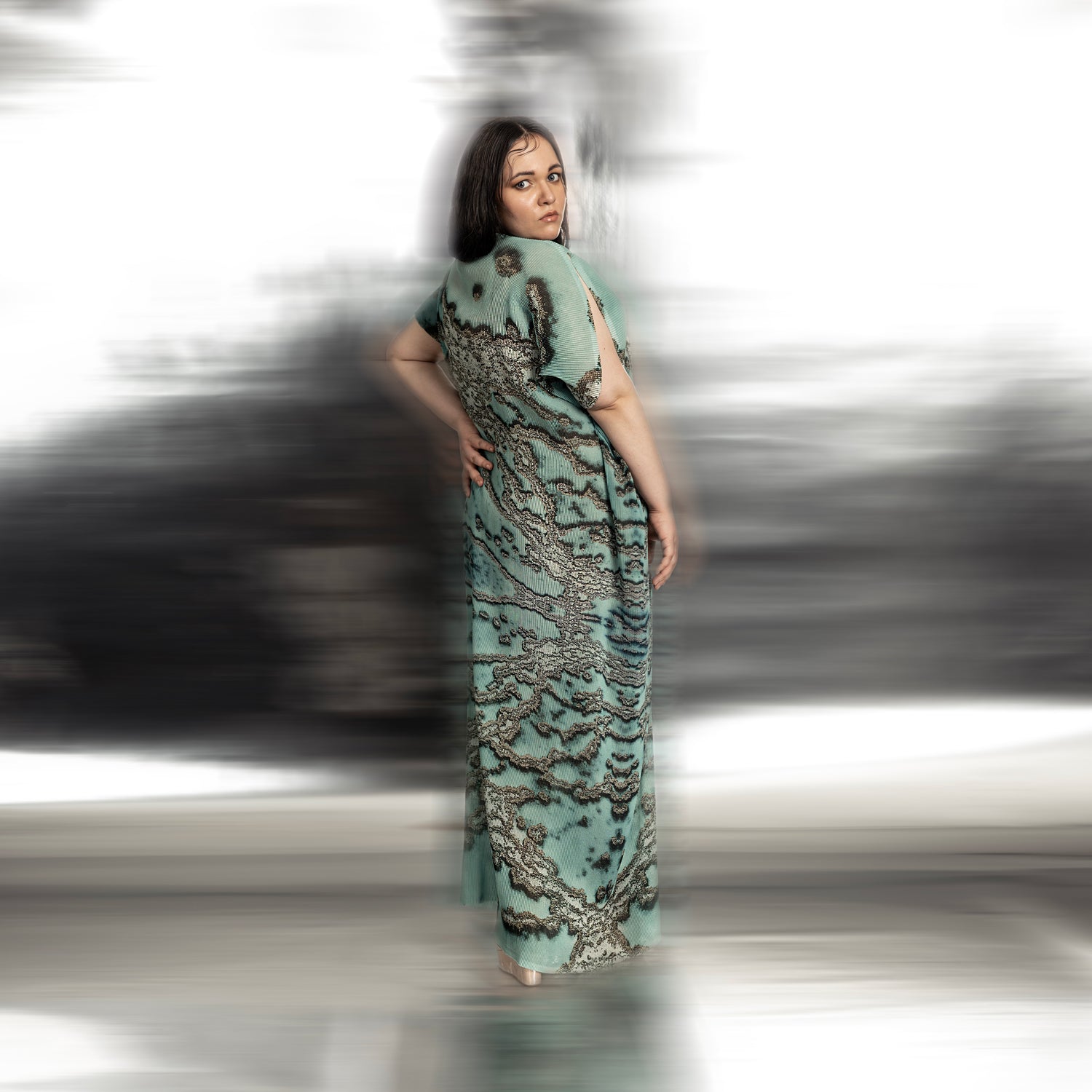 back view of Women's reef-inspired textured gown with drop sleeves and back pleats – oceanic pattern formal dress