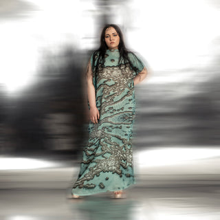 full body view of Women's reef print full-length gown with raised neckline and soft pleated texture – evening occasion wear