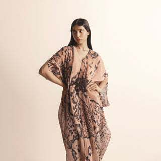 upperbody of Women's blush reef printed asymmetric draped dress with heat textured applique – artistic coral-inspired couture wear