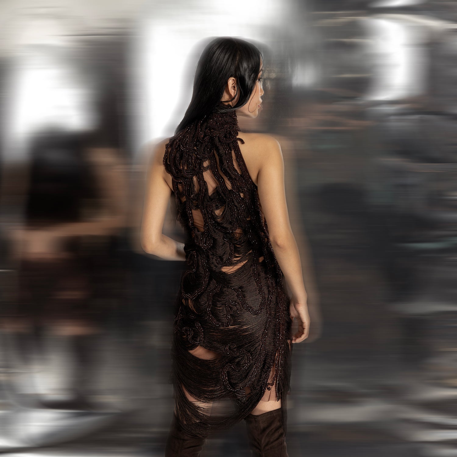 Back view of women's reef-textured yarn draped mini dress in deep brown – sculptural turtle neck couture for youngsters