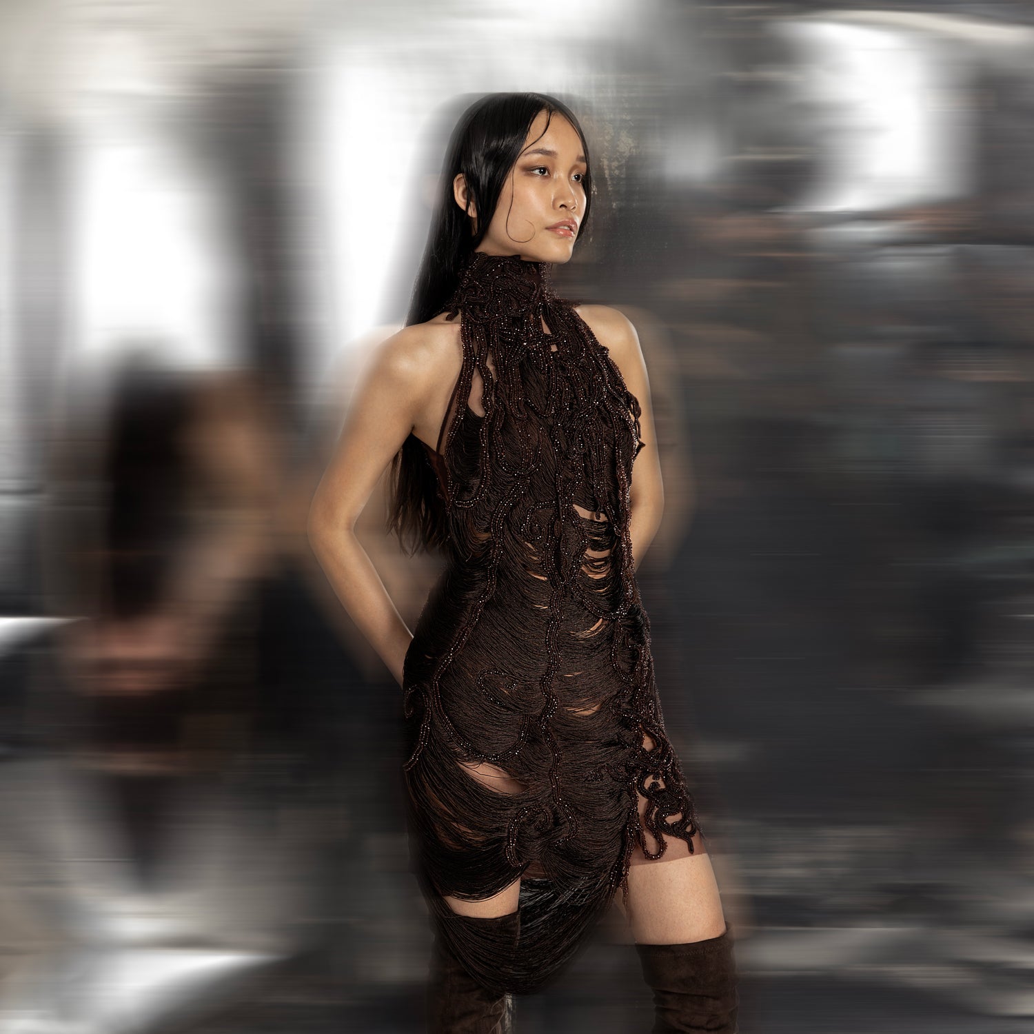 Women's sculpted reef-style mini dress in dark yarn with turtle neckline and textural draping – edgy youngster look