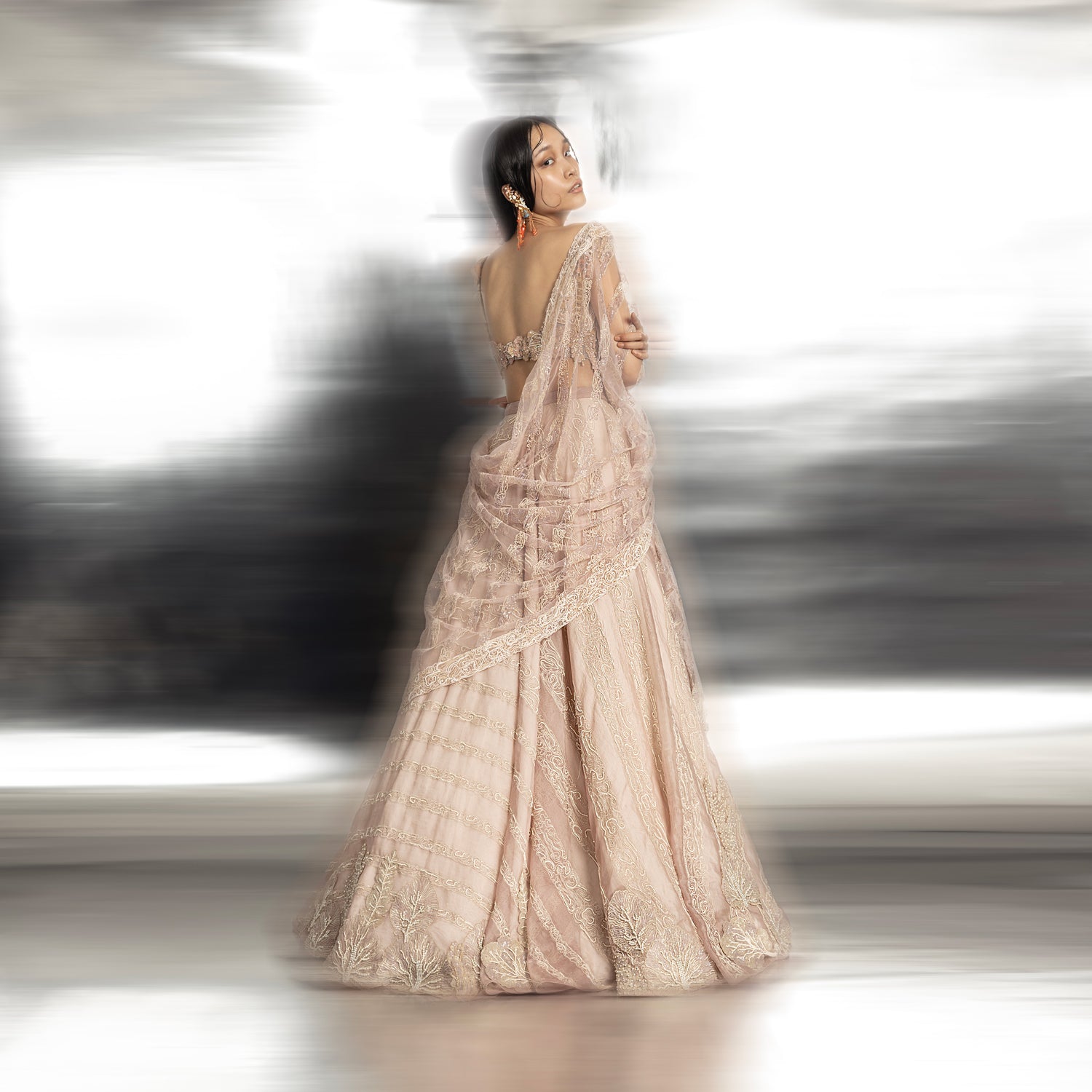 back full length of Women's back view of silk organza lehenga with reef motifs and geometric embroidery – artistic bridal couture set