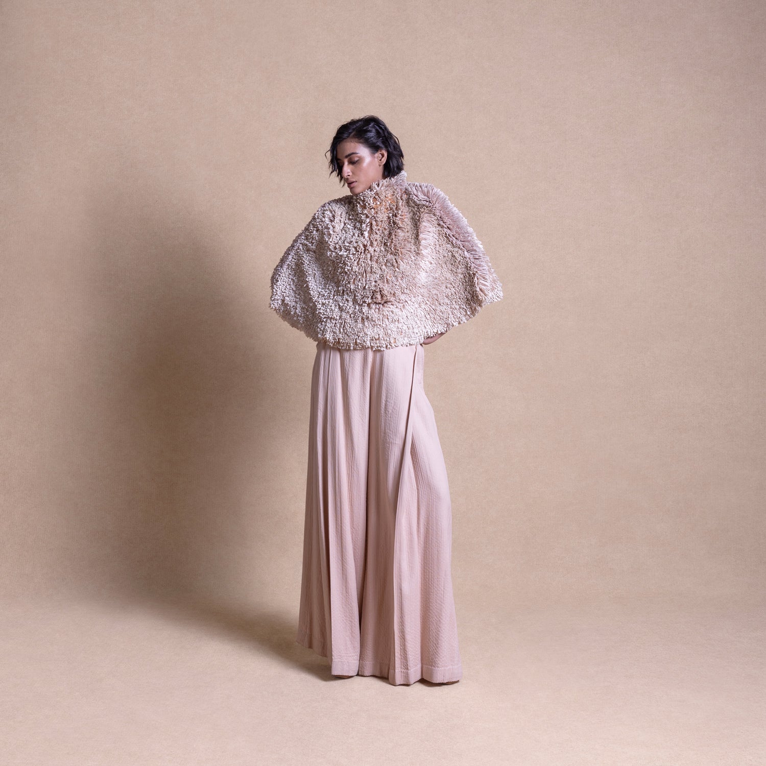 Textured cape with quilted pants – luxury loungewear with edge, top and trouser.