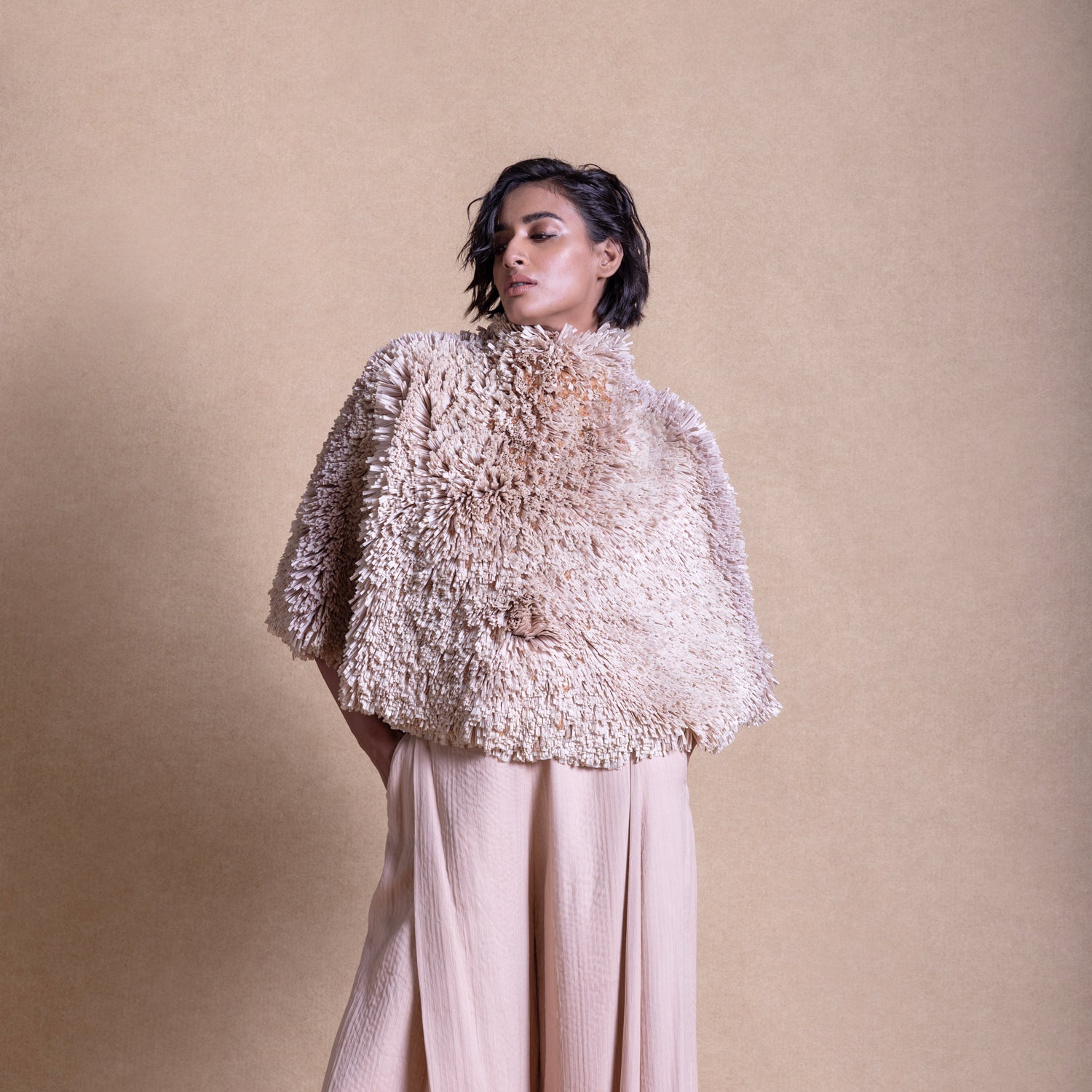Close-up of textured cape with quilted pants - luxury loungewear with edge, top and trouser, Designer loungewear