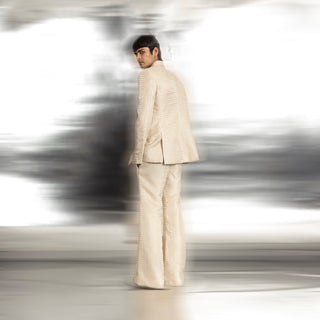 full back view of Men's ivory textured blazer with shawl collar and side slit detail – coordinated red carpet ensemble from back view