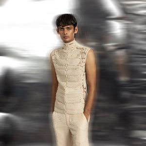 front upper view of Men's sculpted ivory yarn couching turtleneck sleeveless top with matching textured trousers – designer red carpet look