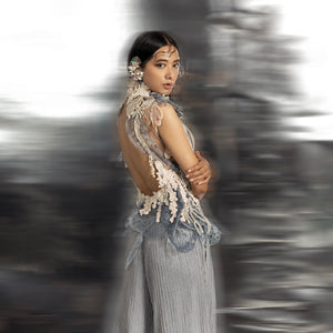 back view of Women's backless sheer top with 3D laser cut applique and structured peplum – couture jumpsuit set