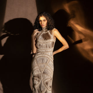 medium shot of Women's sculpted fringe yarn gown with high neck and textural detailing – modern handcrafted couture look