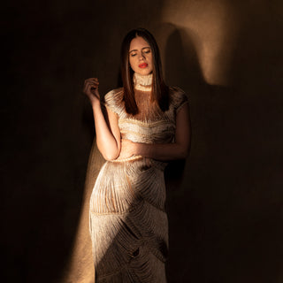 upper body view of Women's gold yarn-crafted gown with layered fringe texture and high neck – contemporary handcrafted couture look