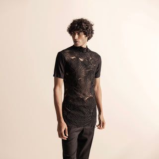 medium view of Men's black semi-sheer top with 3D yarn embroidery and short sleeves – bold couture pairing with tailored pants 