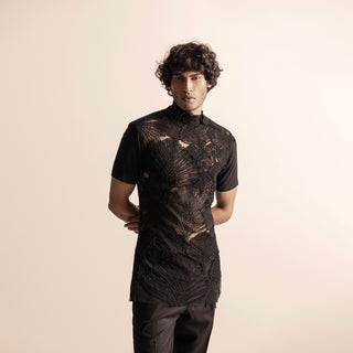 Men's black short-sleeve top with sheer base and raised leaf embroidery – couture festivewear with modern edge