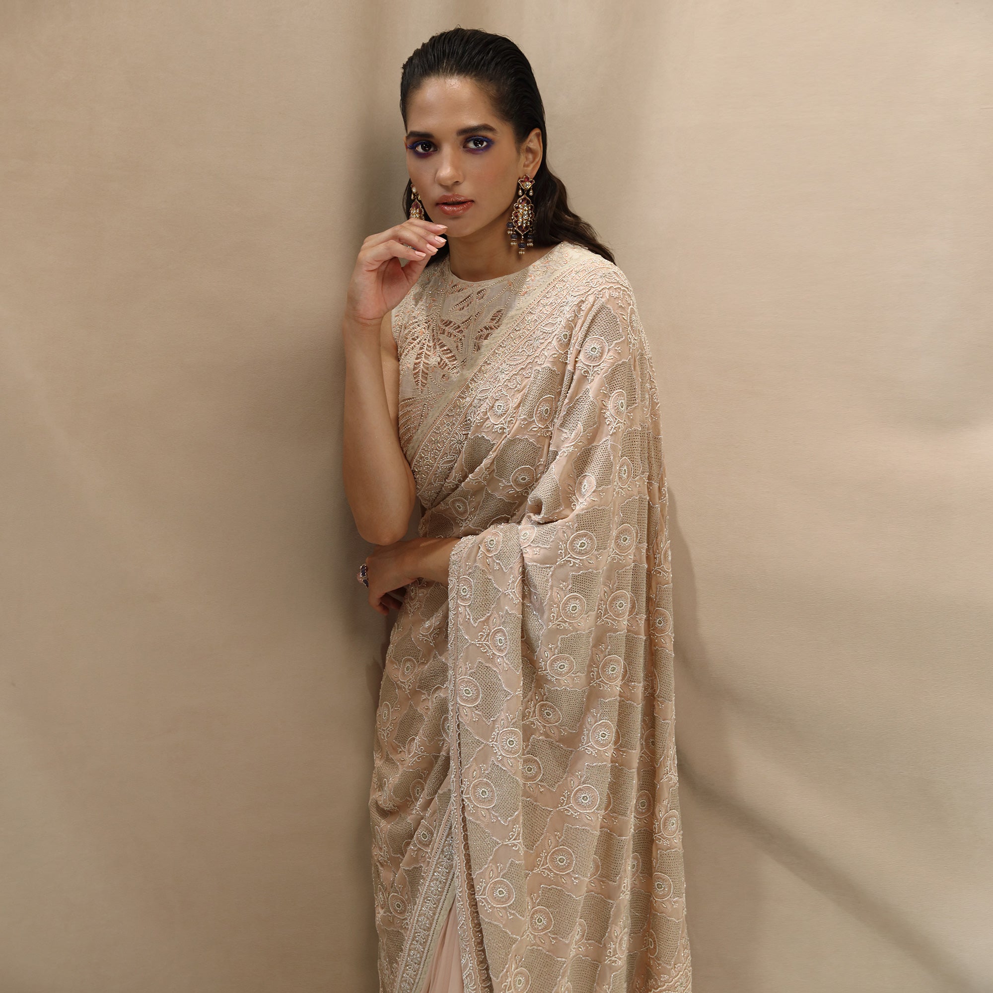 Fine chikankari saree with intense zari jaali detailing and intense pearl embroidery, teamed up with net applique embellished blouse. The saree has an intense display of fine chikankari craftsmanship. The palla has beautiful zari jaali work all densely done by the craftsmen from Lucknow showing the finest of skills. #Abhishekstudio #abhisheksharma  #fashiondesignerabhisheksharma #designerware #ambawattaone #lakmefashionweek  #weddingware #bridal #modrenbride #chikankari