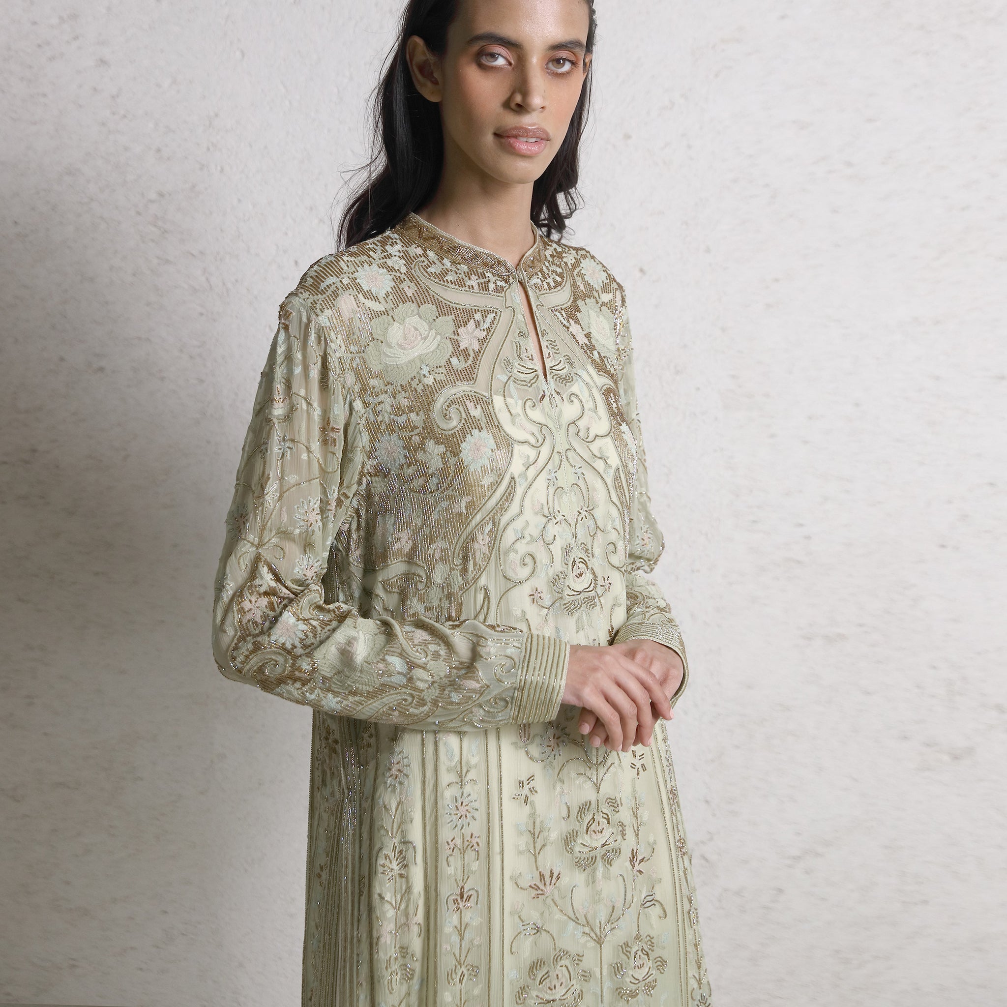 Multi-color fine shadow works chiffon straight cut kurta with Cutdana detailing paired with the draped inner layer, pants, and stole. The look has underline bling with elegance. The style has a good drape and adds a delicate feel to the person wearing it. A look that completely works for a day or evening wedding. #Abhishekstudio #abhisheksharma  #fashiondesignerabhisheksharma #designerware #ambawattaone #lakmefashionweek #wommen’sware 