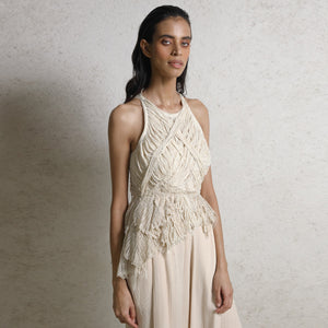 Yarn draped and hand tacked detailed top that is one of its kind marring art and fashion together. Yarn draped incut shoulder embellished asymmetric teamed up with chiffon textured wide hem high-waisted pants. The look has an uber-sophisticated feel along with the edgy avantgarde mood. #Abhishekstudio #abhisheksharma  #fashiondesignerabhisheksharma #designerware #ambawattaone #lakmefashionweek #wommen’sware 