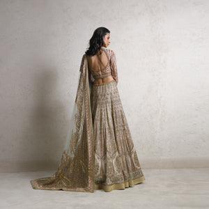 Silk organza multiple kali flared lehenga with a fine Resham and sequin embroidery bringing the royal vintage feel. Delicately embroidered blouse and exotic dupatta complete the look. This vintage royal look is a perfect pick for the bride who wants to look regal and delicate at the same time. #Abhishekstudio #abhisheksharma  #fashiondesignerabhisheksharma #designerware #ambawattaone #lakmefashionweek  #weddingware #bridal #modrenbride 