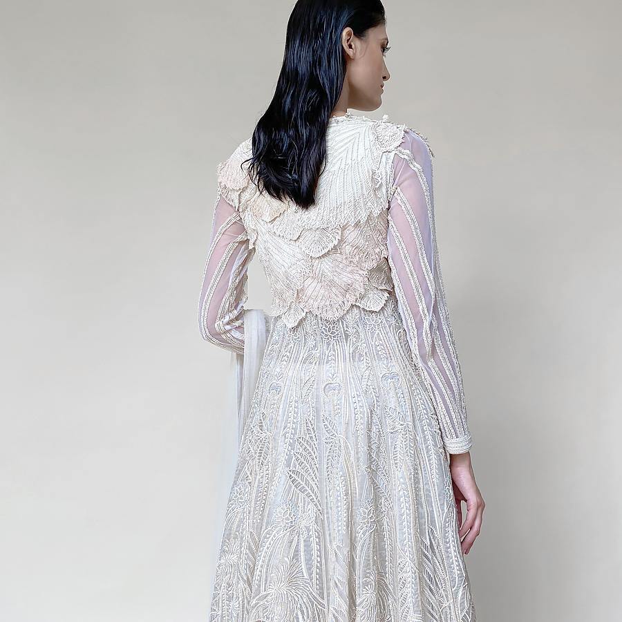 Organza embellished Anarkali with 3D draped embroidered bodice and dupatta. The Anarkali is designed taking inspiration from the beautiful palm trees and forest. There is a fine play of delicate net applique with fine Reshma and pearl detailing. The look has a very delicate and feminine vibe. Abhishek Sharma, abhishekstudio