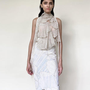 front view of Women's ivory 3D halter top with fringe tassels and pastel textured skirt for modern couture styling