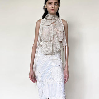 front view of Women's ivory 3D halter top with fringe tassels and pastel textured skirt for modern couture styling