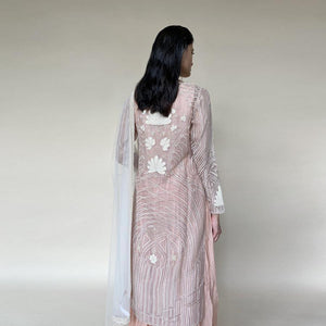 Organza silk kurta with fine Gresham and velvet applique embroidery embellished with pearl and katdana. There is separate crinkled voile inner that gives the style a layered look. Elegance and delicate details are the main focus of the look. Abhishek Sharma, abhishekstudio