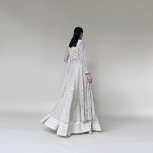 Organza embellished Anarkali with 3D draped embroidered bodice and dupatta. The Anarkali is designed taking inspiration from the beautiful palm trees and forest. There is a fine play of delicate net applique with fine Reshma and pearl detailing. The look has a very delicate and feminine vibe. Abhishek Sharma, abhishekstudio
