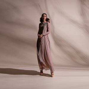 Layered kurta dress gracefully draped in bias cut chiffon is offered with a stretch net pants. Dress is embellished with forest pattern delicate thread and pearl embroidery. abhishek sharma, abhishekstudio