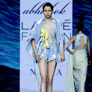 Multi textured short top embellished with 3D draped embroidery and satin drip detailing. The tope can be teamed with teared denim or even with wide pants. Abhishek Sharma, Abhishekstudio.