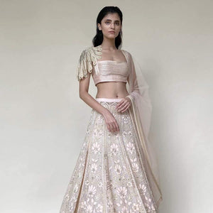 Organza lengha ornated with fine Resham, beads and velvet applique embroidery. The Lehenga has elegance and luxury as it's defining features. The Lehenga is designed keeping in mind the modern-day bride who is confident and know how to be in this global world. The look is perfect for a day wedding reception or even for rokka. The look can be styled with diamonds and pearl exotic jewellery.  Abhishek Sharma, abhishekstudio