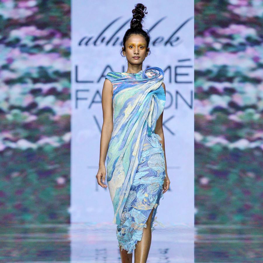 Exaggerated shoulder asymmetric top and embellished skirt. abhishekstudio, abhisheksharma 