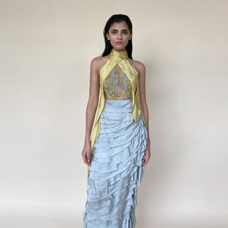 The look has turtle neck draped embroidery detailing along with satin drip texturing. The skirt has multiple layer of satin with asymmetrical patterns. The look is perfect for red carpet and event where you are the head turner. Lead the evening with this power packed strong look. Abhishek Sharma, abhishekstudio 