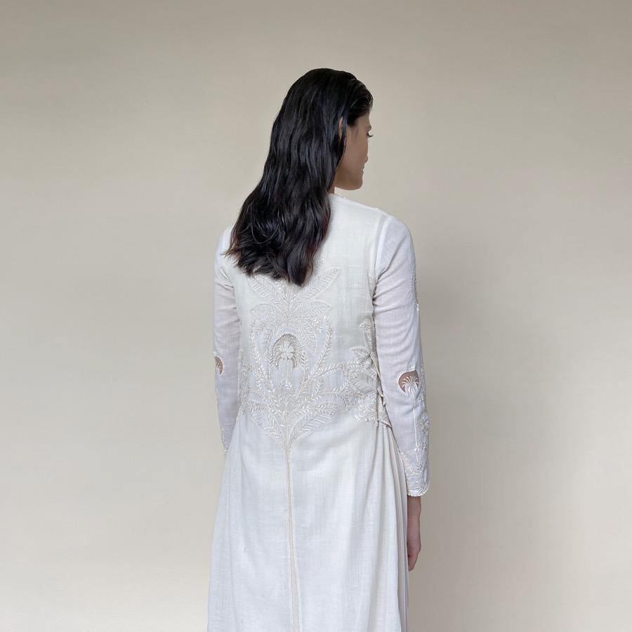 Straight Kurta with fine Resham and pearl embellishment having pleated georgette detailing in the inner layer with wide pants. The kurta is designed taking inspiration from the versatile nature of forest and art of miniature paintings. The look has a delicate and elegant feel and is the best for someone who has a very refined taste of style. The look worked perfectly for a day as well as evening. Abhishekstudio, Abhishek sharma