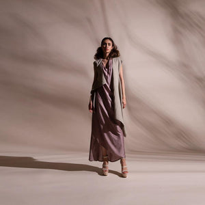 Asymmetric sleeveless draped jacket teamed up with satin draped dress. Crafted in fluid fabrics, Abhishek Sharma’s modern statement pieces pack in innovative drapery. abhishek sharma, abhishekstudio