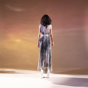 Abhishek Sharma’s fresh-off-the-runway collection features unconventional drapes with printed textures. Impressionist printed textured georgette draped dress with placement embroidery in fine Gresham, sequin and bead. The dress has a satin tie-up waist belt to accentuate the waist. It's a perfect look for a day that can even work for a relaxed evening. Abhishekstudio, abhishek Sharma