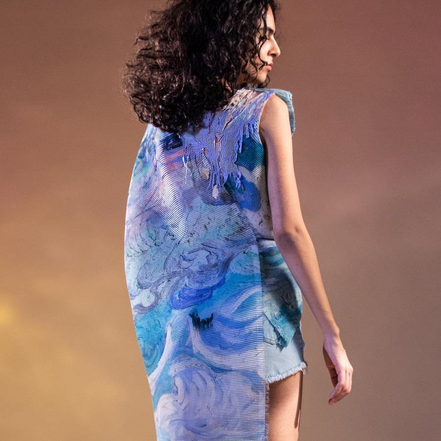 Abhishek Sharma’s fresh-off-the-runway collection features unconventional drapes with printed textures. Impressionist printed textured draped fluted top. The top has a dramatic young vibe with a draped wave and extended shoulder cowl. Abhishekstudio, abhisheksharma