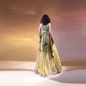 Silk organza flared lehnga with geometric fine resham and sequence embroidery teamed up chiffon couching overlap jacket. There is graphic play of lines and textures on the jacket. The jacket have modern  carefree vibe. The jacket has a tie up satin belt that accentuate the waist line and add style to the look. The skirt has graphic of fine Resham embellished lines giving it a edgy look. The out is apt for someone who loves newness and twist on the traditional values. Abhishekstudio, Abhishek Sharma 